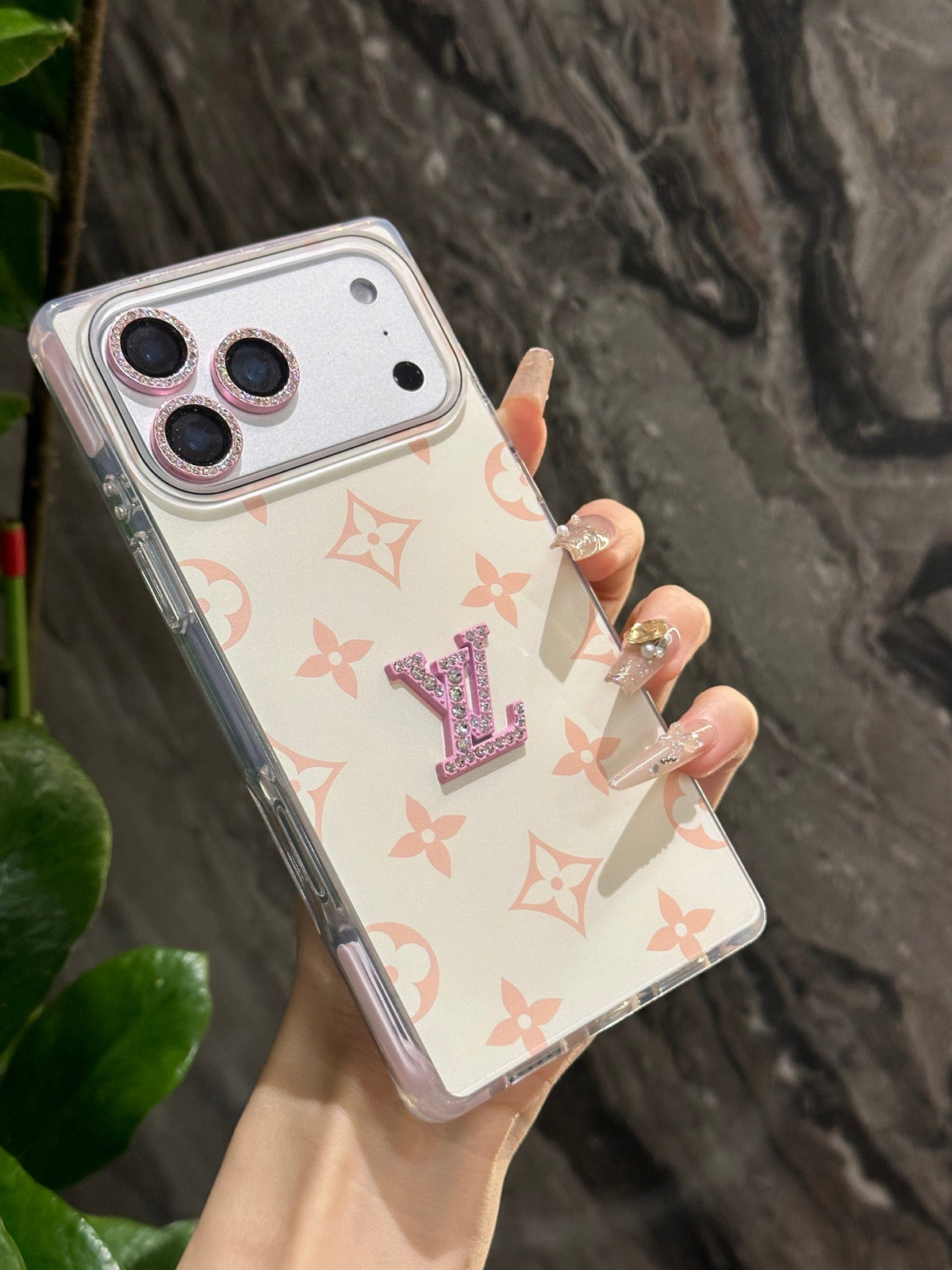 White pastel monogram iPhone case with a raised center emblem
