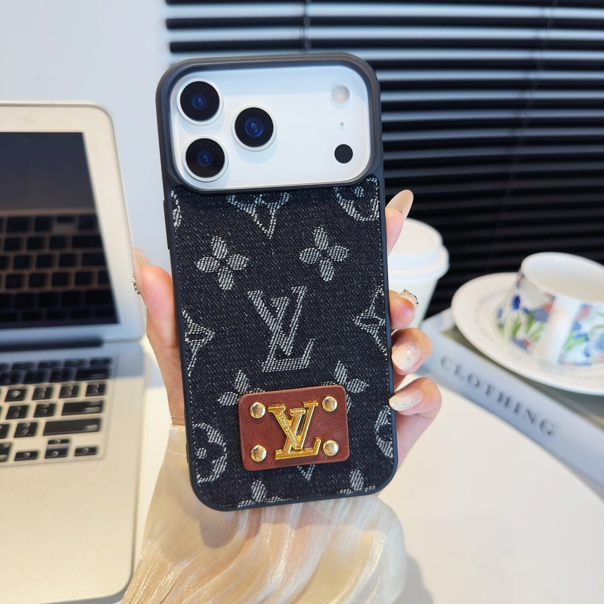 Black monogram iPhone case with a brown back card pocket