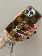 Multicolor checked iPhone case with a decorative wrist charm