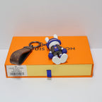 Front view of rabbit keychain lying flat with white soles