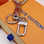 Bottle opener keychain showing silver-tone clasp and connecting links