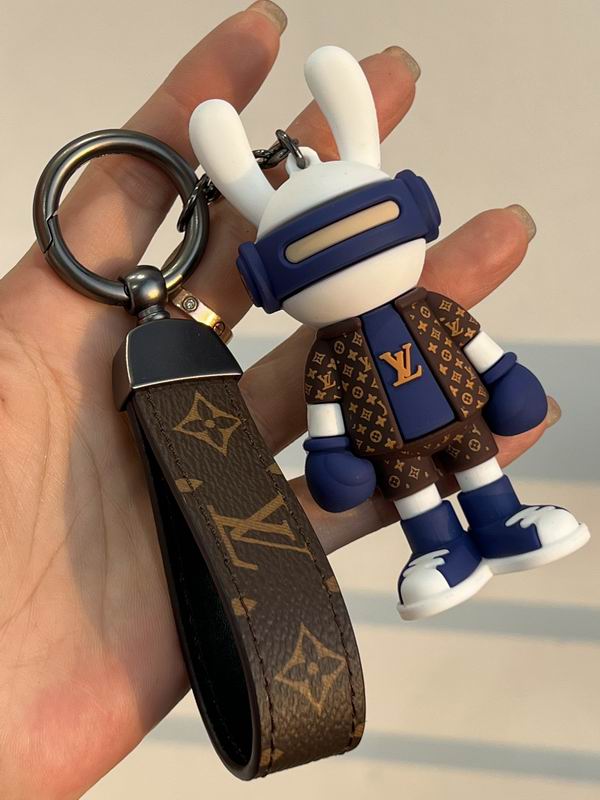 Bunny boxer keychain and monogram strap held in a palm