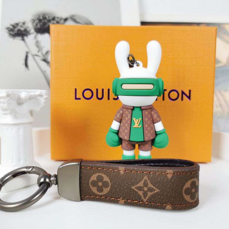 Green bunny boxer keychain standing behind its monogram strap