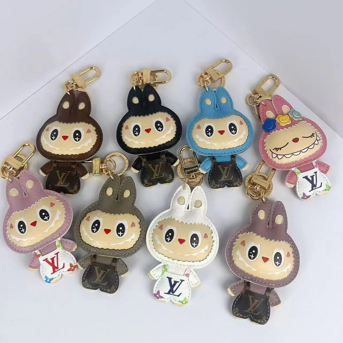 Labubu character keychains in eight colors with gold-tone clasps