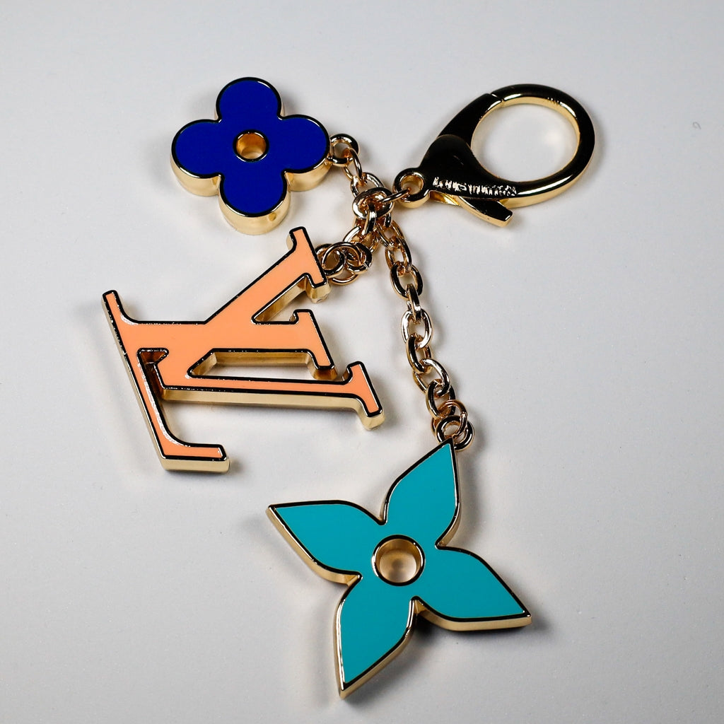 Orange LV pendant with turquoise and dark blue flower charms