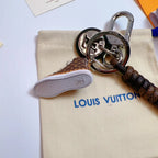 Sole view of brown sneaker keychain with silver-tone hardware