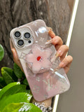 Pale pink iPhone case with a three-dimensional flower grip