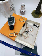 Floral chain keychain arranged beside a black car key