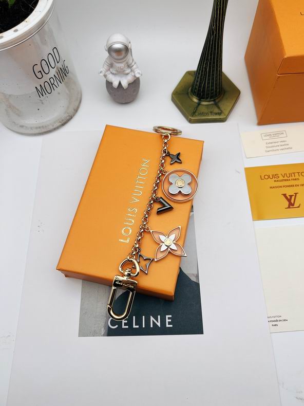Full-length ornament chain keychain laid across orange packaging
